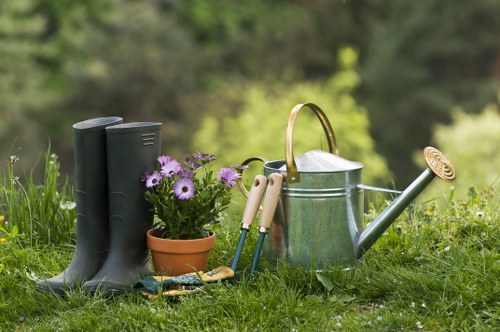 Crew using protective gear during garden maintenance in Balham